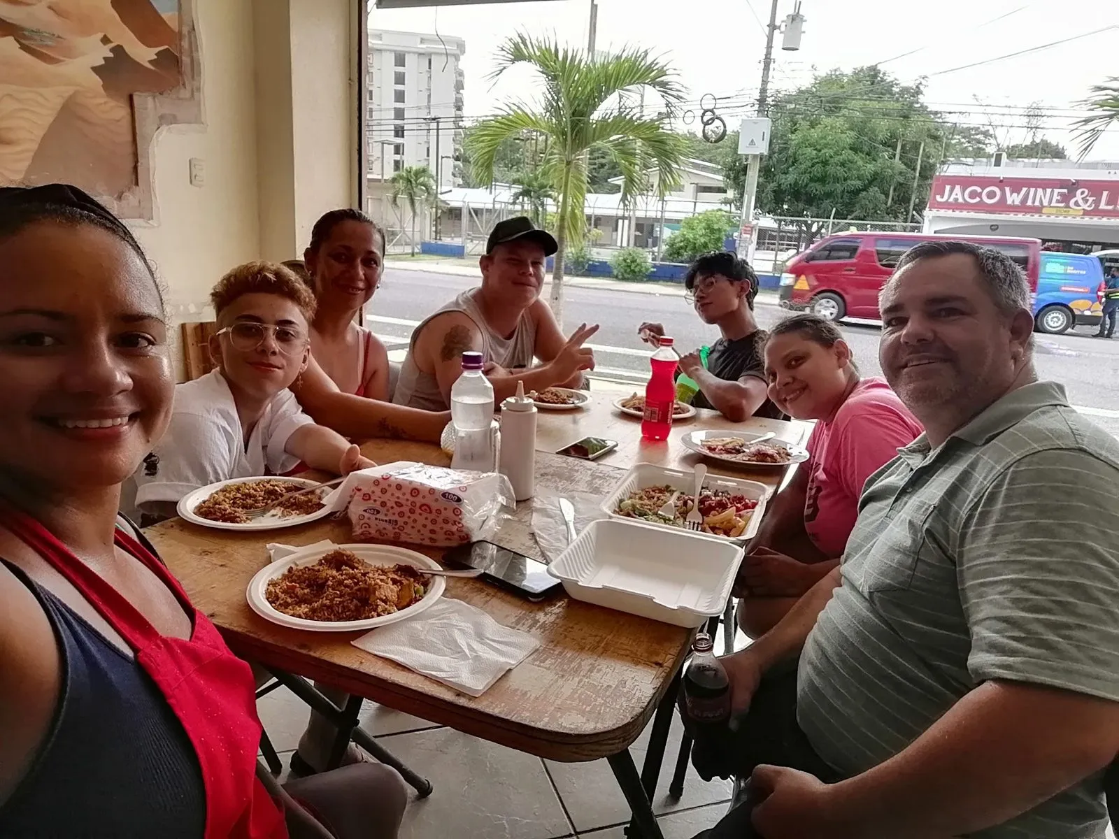 A group of travelers sharing lunch around a table