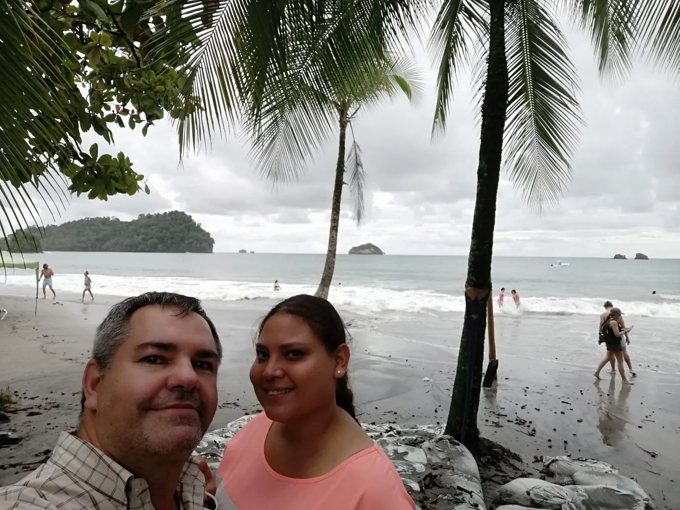 Gonzalo and a traveler taking a selfie on the beach at Manuel Antonio